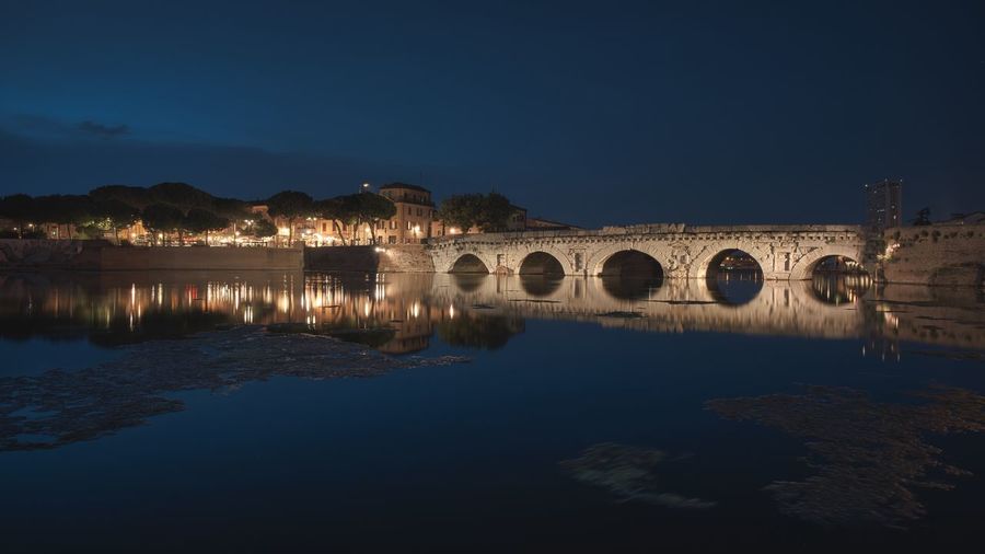 Evening near at the augustus tiberius roman bridge in rimini