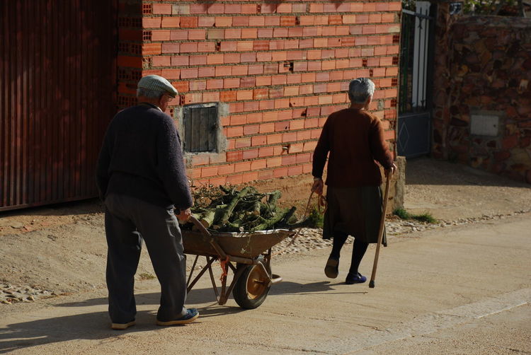 Full length of senior couple on street