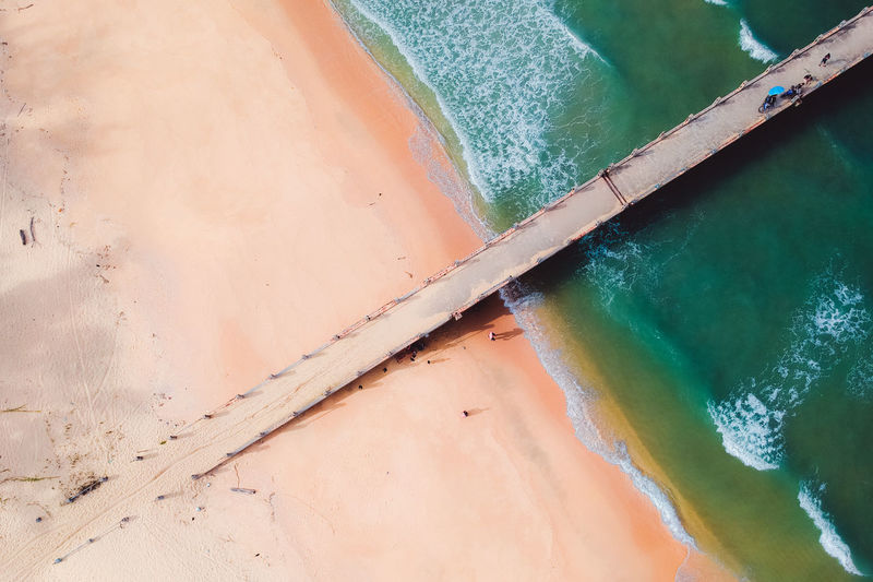 Aerial view of jetty on beach