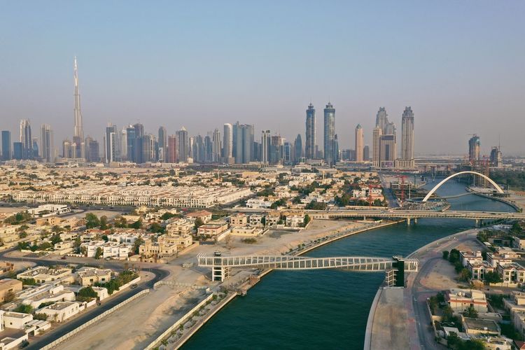 Dubai downtown, business bay and safa as well as water canal and bridge of tolerance from a drone