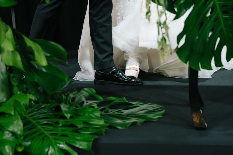 The bride stepped on the groom's feet.