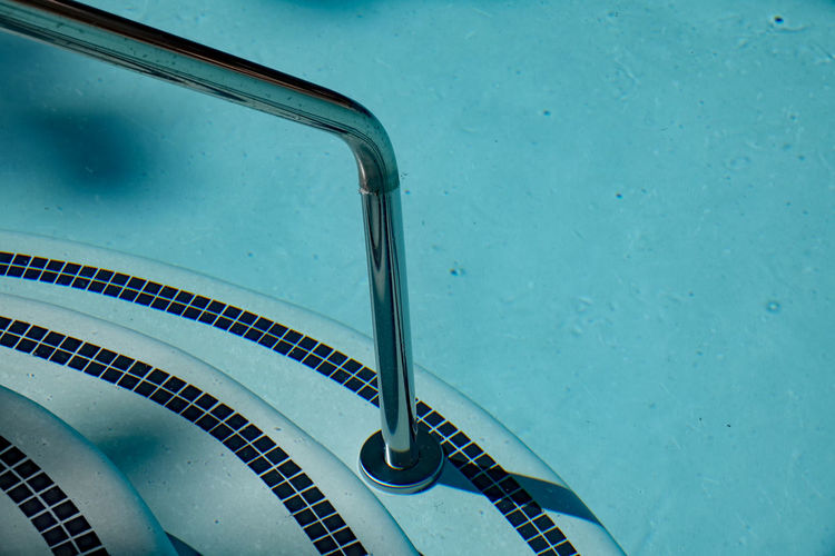 High angle view of staircase in swimming pool