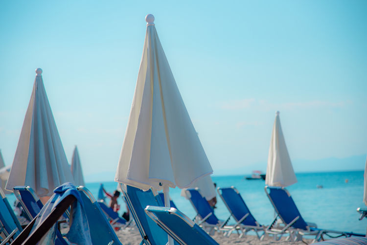 Boats in sea against clear sky