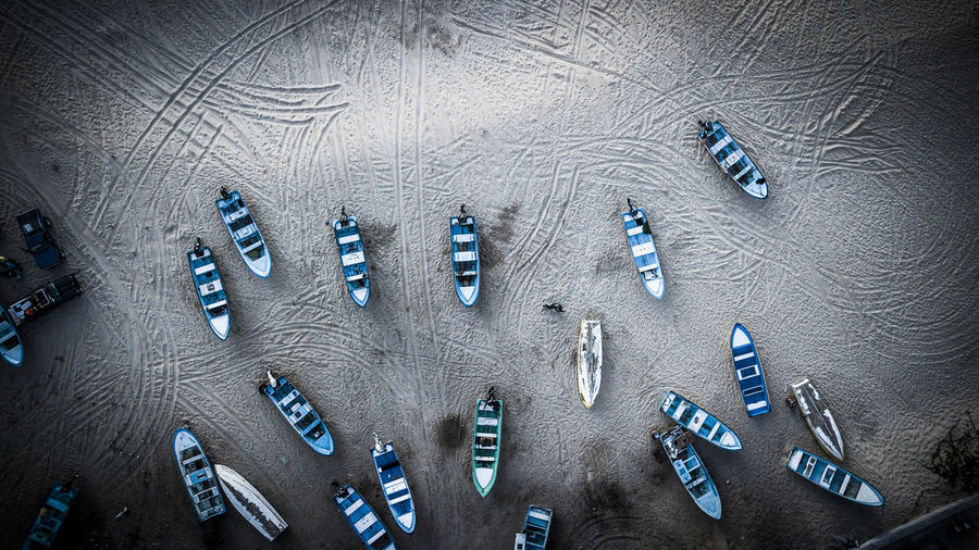 High angle view of boats on sand at beach