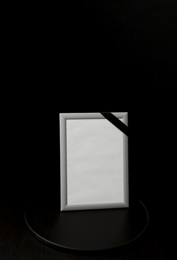 Close-up of electric lamp in darkroom
