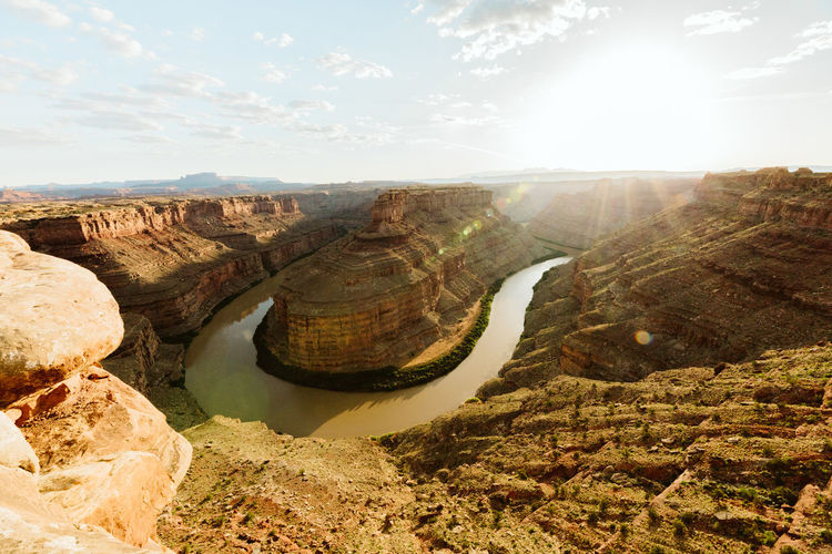 Sun shines over a big bend in the green river canyon in canyonlands