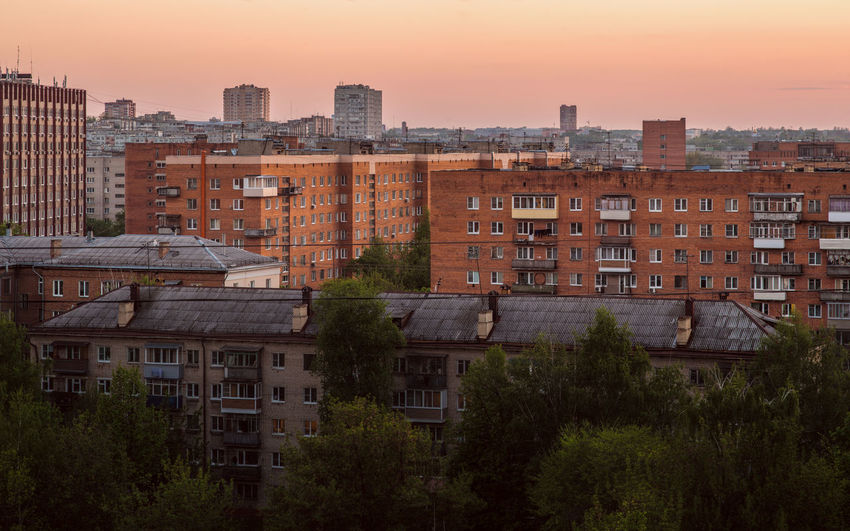 Russian province brick houses cityscape at evening