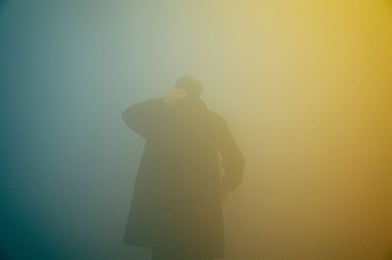 Rear view of man in foggy weather