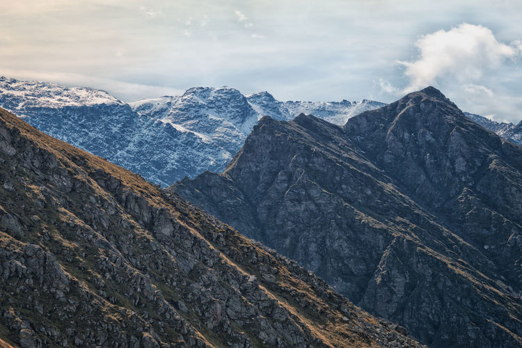 Scenic view of mountains against sky during winter
