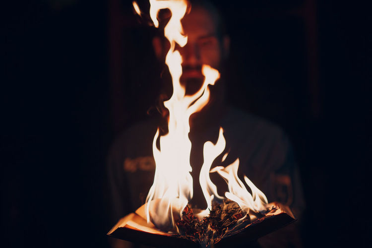 Close-up of fire burning in the dark