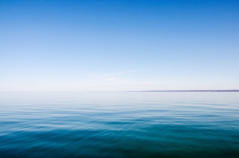 Scenic view of lake ontario against clear blue sky