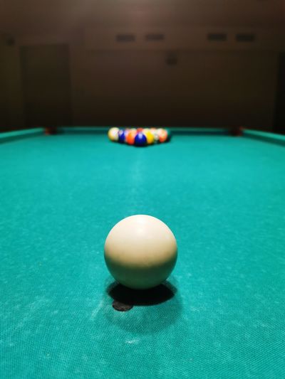 Close-up of ball on table, snooker game