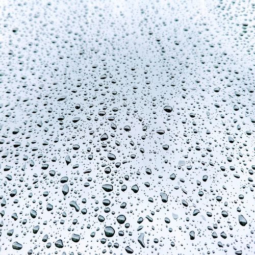 Full frame shot of wet surface with clear water droplets