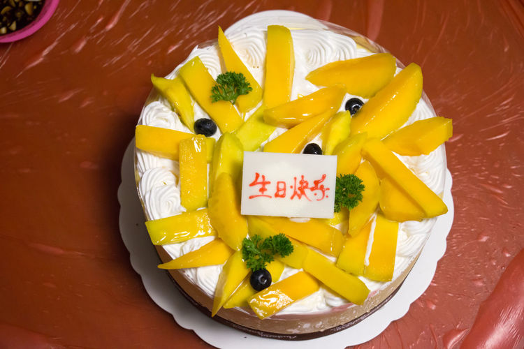 High angle view of fresh fruitcake with label
