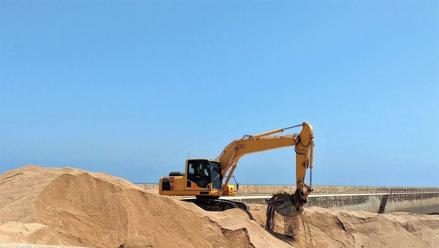Digger moving sand