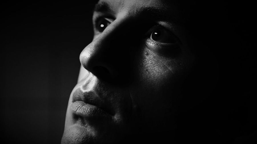 Close-up of man in dark