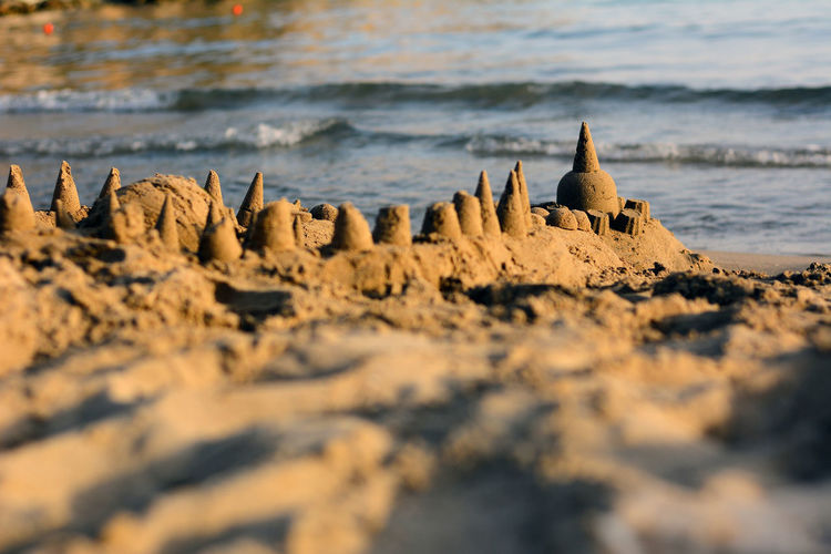 Sand castle, low view, with the sea in the background