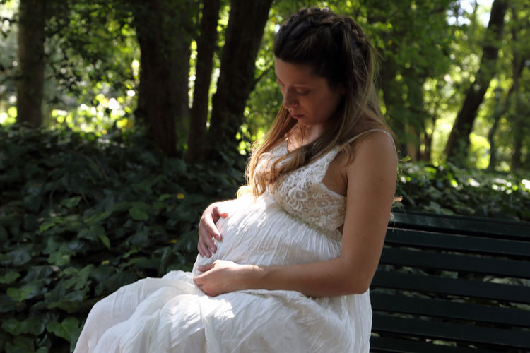 Young pregnant woman in the park