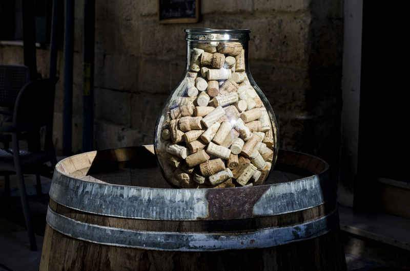 Corks in jar on barrel