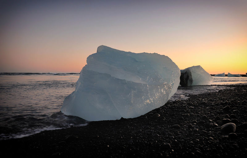 Scenic view of sea against sky during sunset at jokulsarlon glacier lagoon, iceland