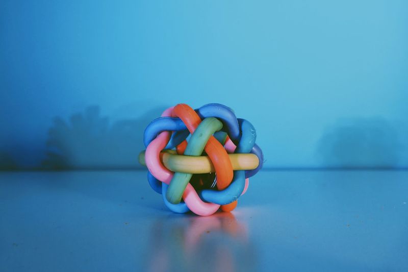 Close-up of multi colored tubes on table