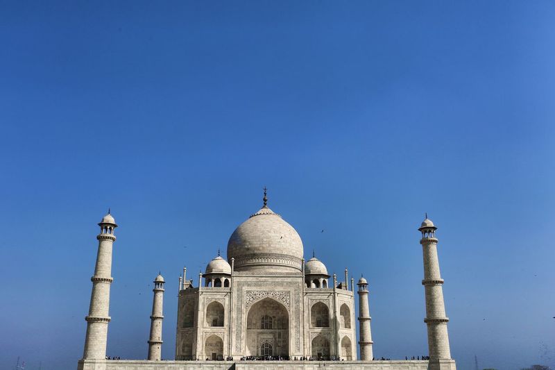 Low angle view of taj mahal against blue sky