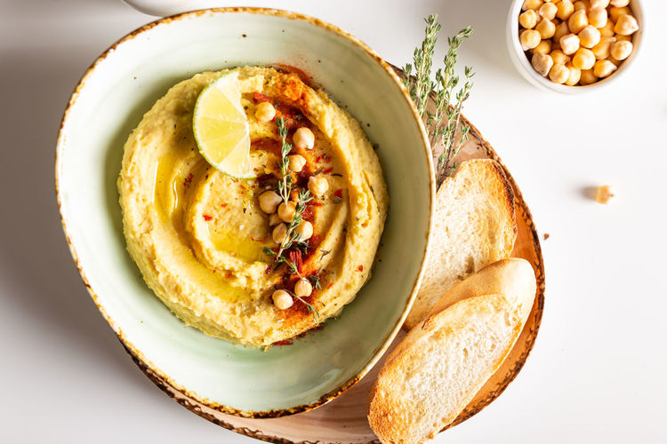 Classic hummus with spices and lime in a bowl