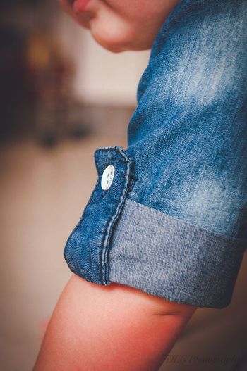 Close-up of baby wearing denim clothes