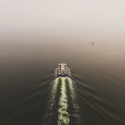 High angle view of boat on sea against sky