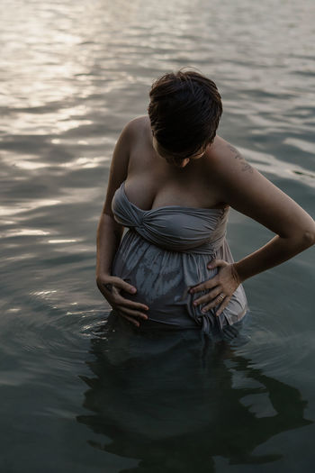 Pregnant woman in lake