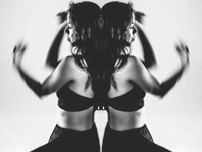 Multiple image of woman dancing against white background