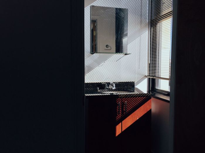 View of bathroom sink next to window