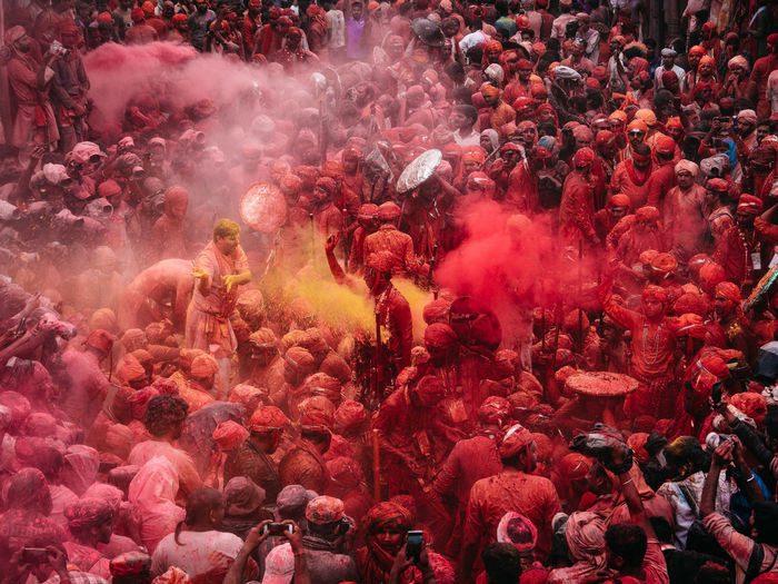 People playing holi in city