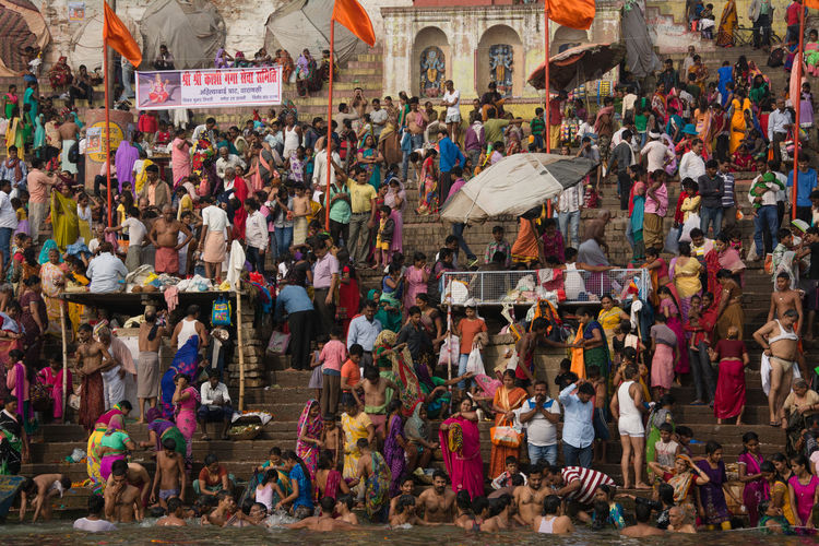 People taking holy dip into river ganga on the ospicious day of dev deepawali, varanasi