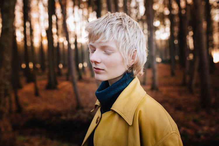 Autumn Beauty Blond Hair Child Females Focus On Foreground Forest Headshot Knitted Leisure Activity Lens Flare Nature One Person One Woman Only Only Women Outdoors People Portrait Real People Scarf Sunlight Sunset Warm Clothing Women Young Adult