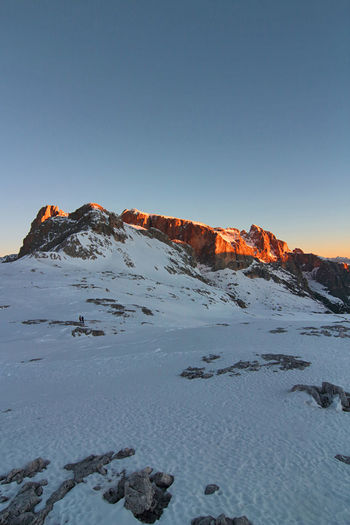 Pale di san martino. unesco italy. scenic view of snowcapped dolomites against clear blue sky.