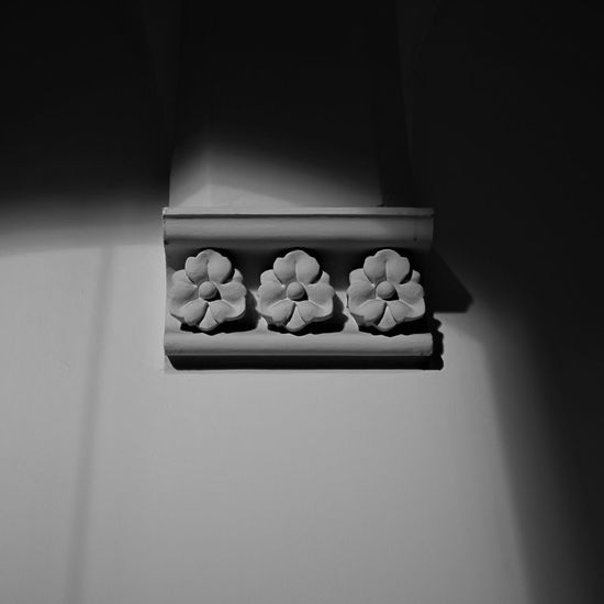 Low angle view of floral carving on wall