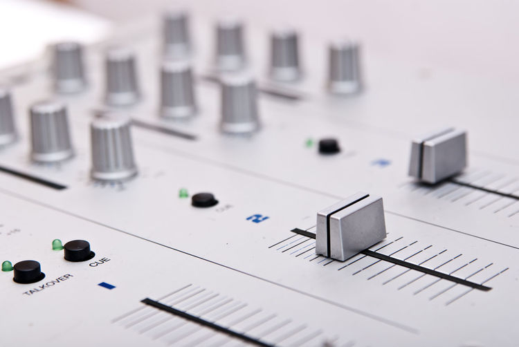 Close-up of sound mixer knobs