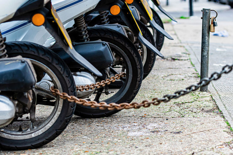 Close-up of motorcycle on street