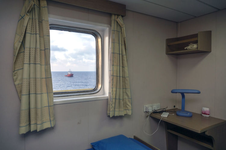 Interior cabin of a client representative on board a construction work barge at offshore oil field