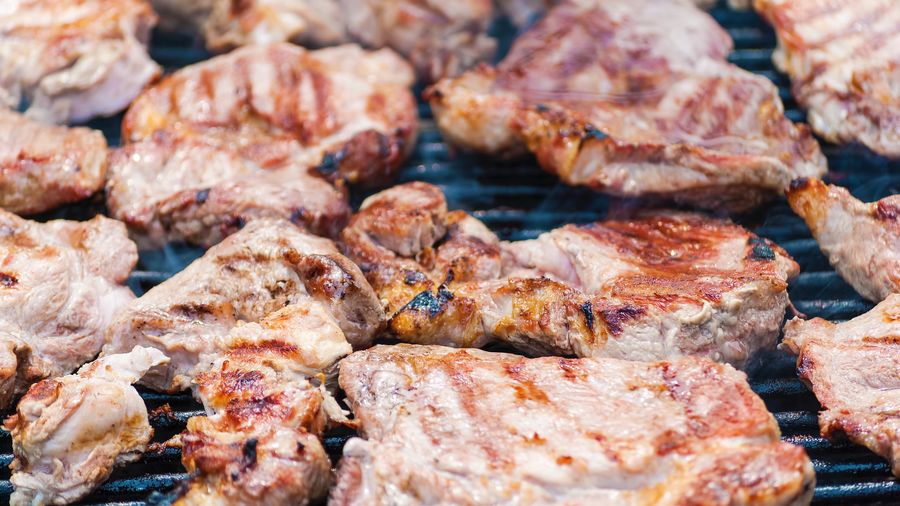 Full frame shot of meat on barbecue grill