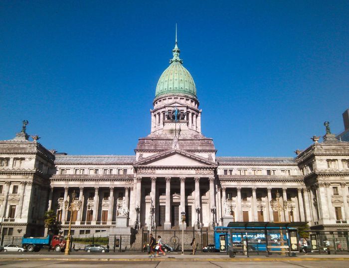 Facade of historic building against clear blue sky