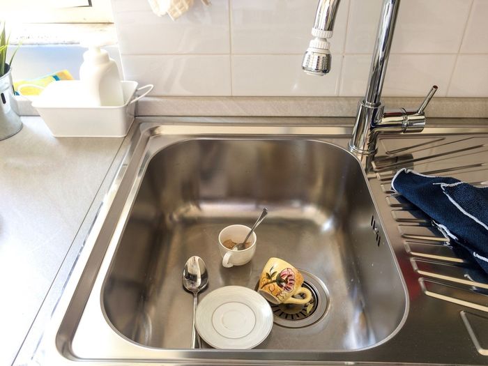 High angle view of crockery in sink at home