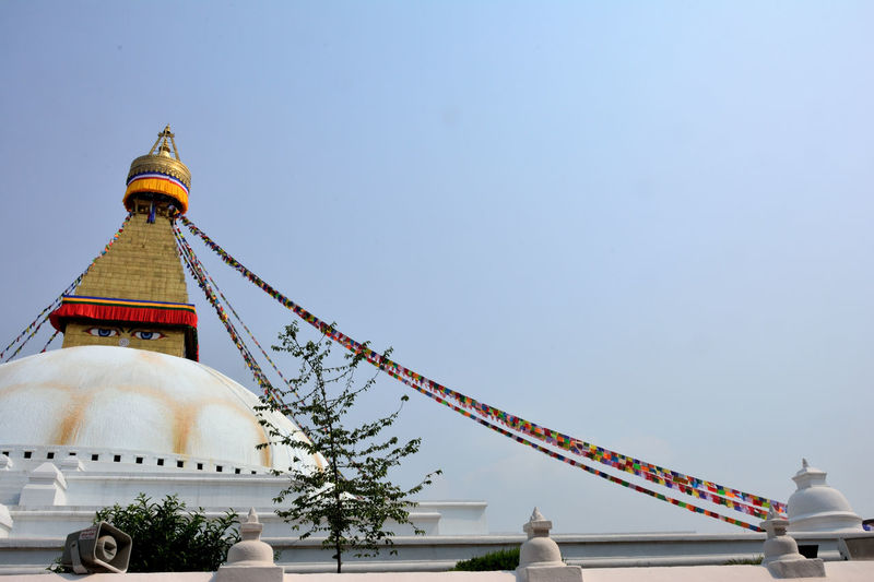 Low angle view of boudhanath stupa against sky
