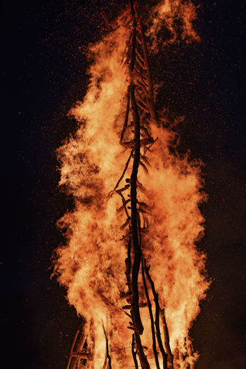 Low angle view of bonfire against sky at night