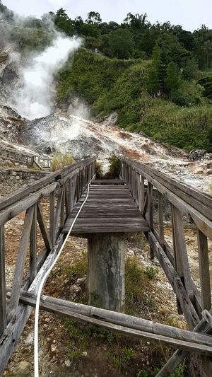 Scenic view of bridge over landscape against sky