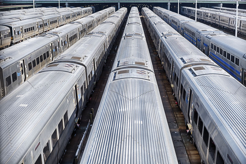 A set of new york city subway trains parked in hudson yards wait to be put into service.