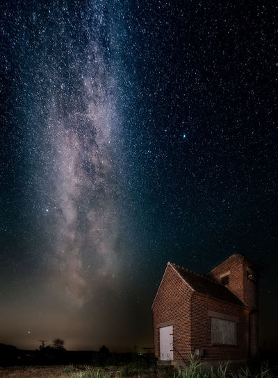 Low angle view of building against sky at night