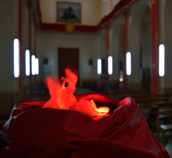 Illuminated lighting equipment amidst fabric in church