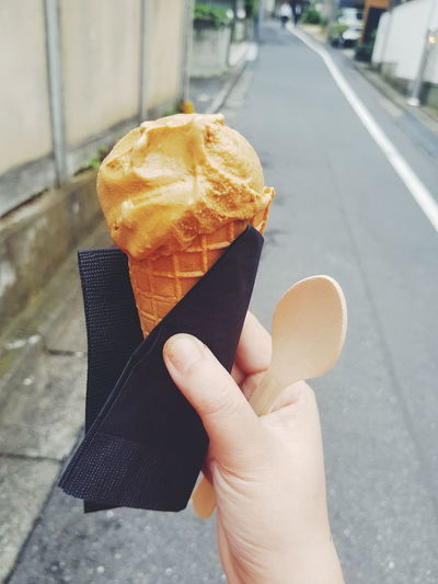 Close-up of person holding ice cream cone